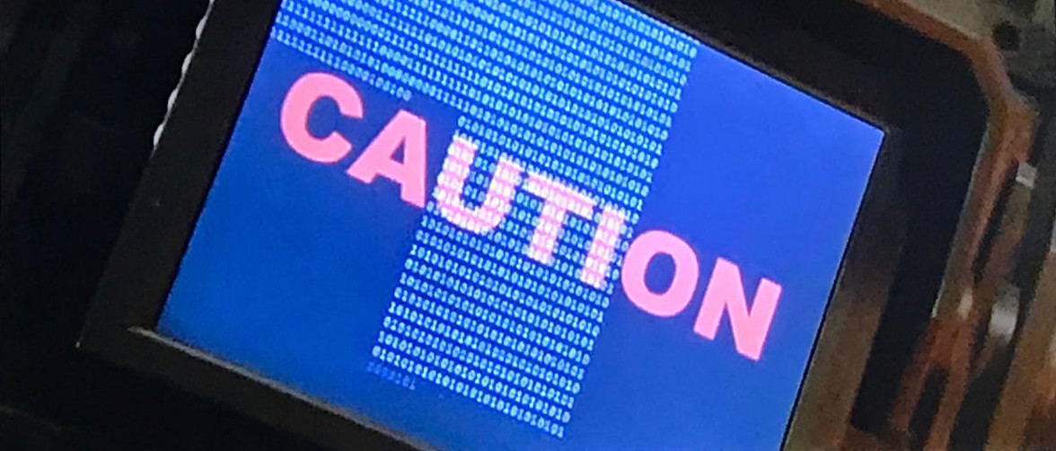 Vorsicht! rein dekoratives Bild: ein Bildschirm mit der Aufschrift "Caution"