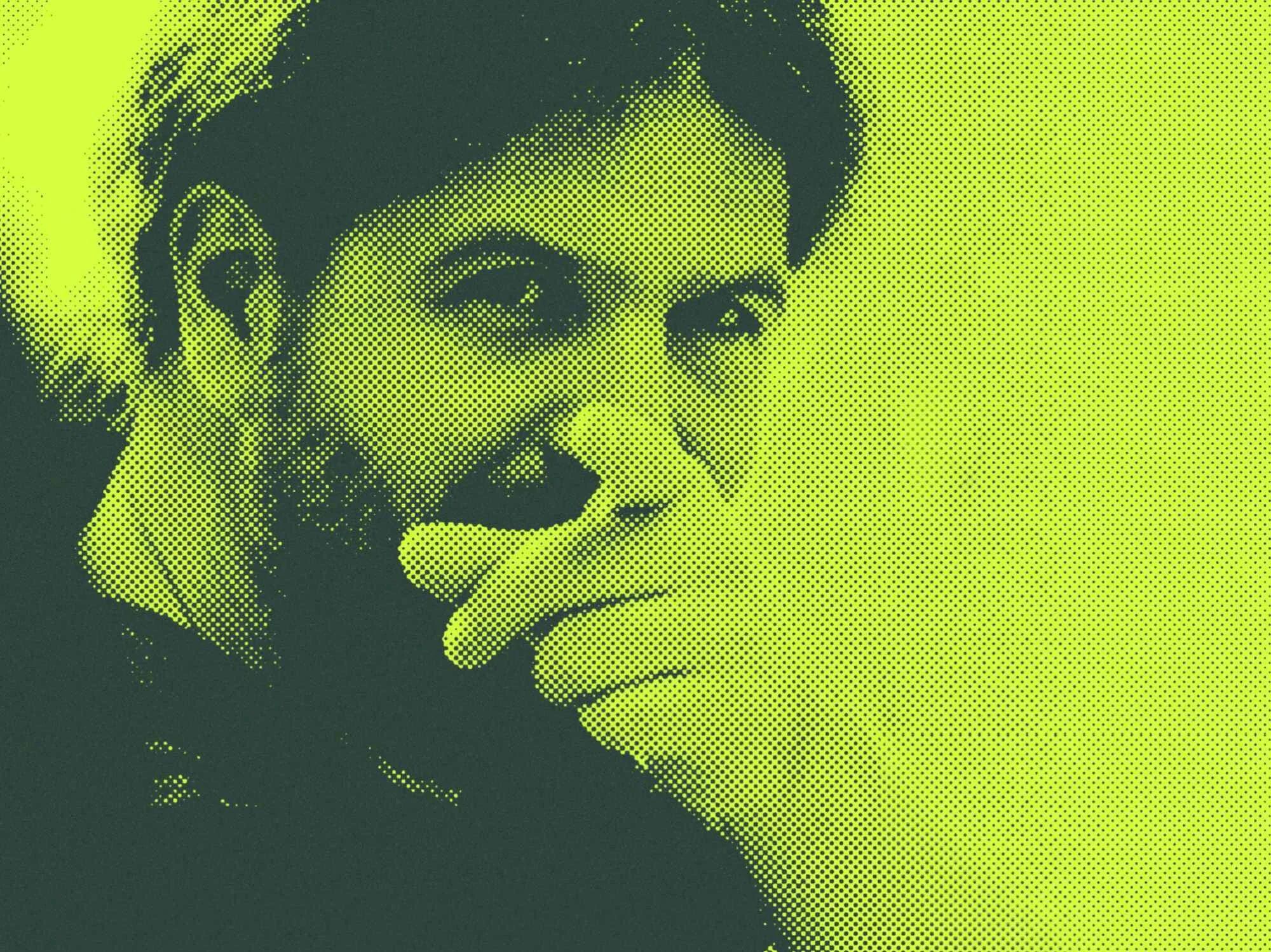 Mann zeigt in Richtung der Kamera